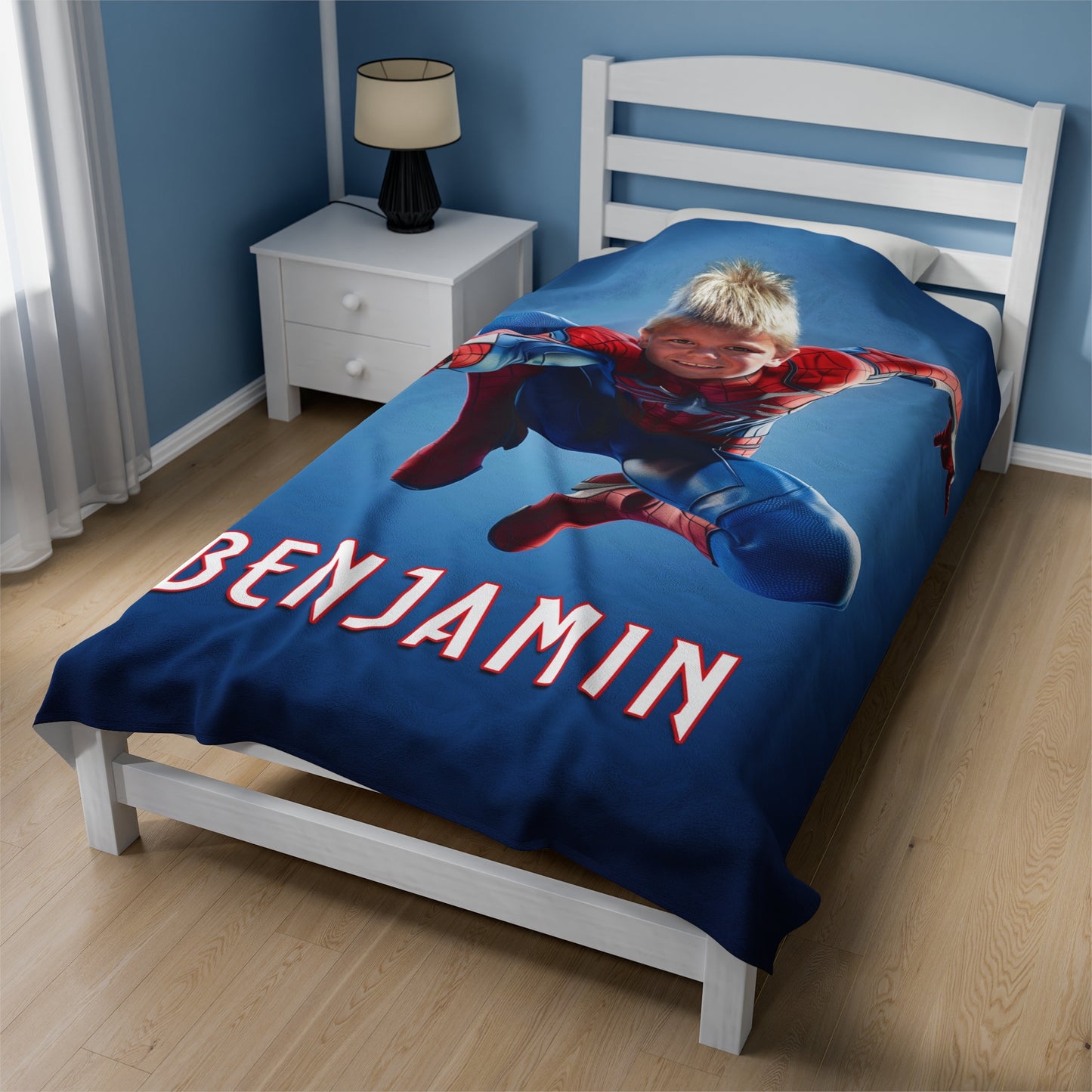 the 60 x 80 inch super hero blanket displayed on a bed