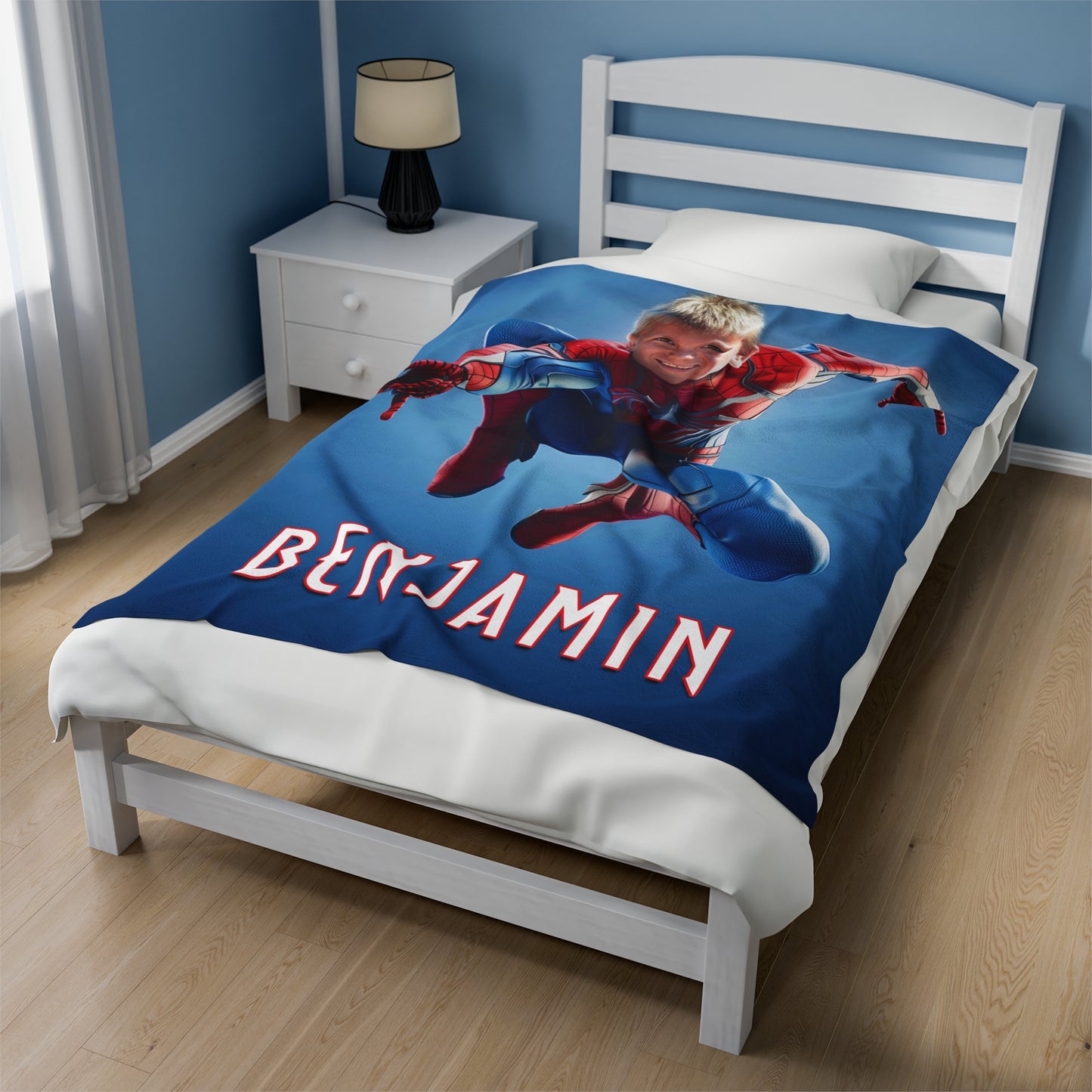 the 50 x 60 inch spider man blanket displayed on a bed
