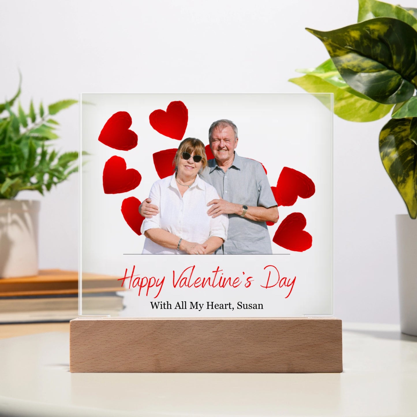 Personalized Valentine's Day photo plaque with a couple and red hearts on a white background.
