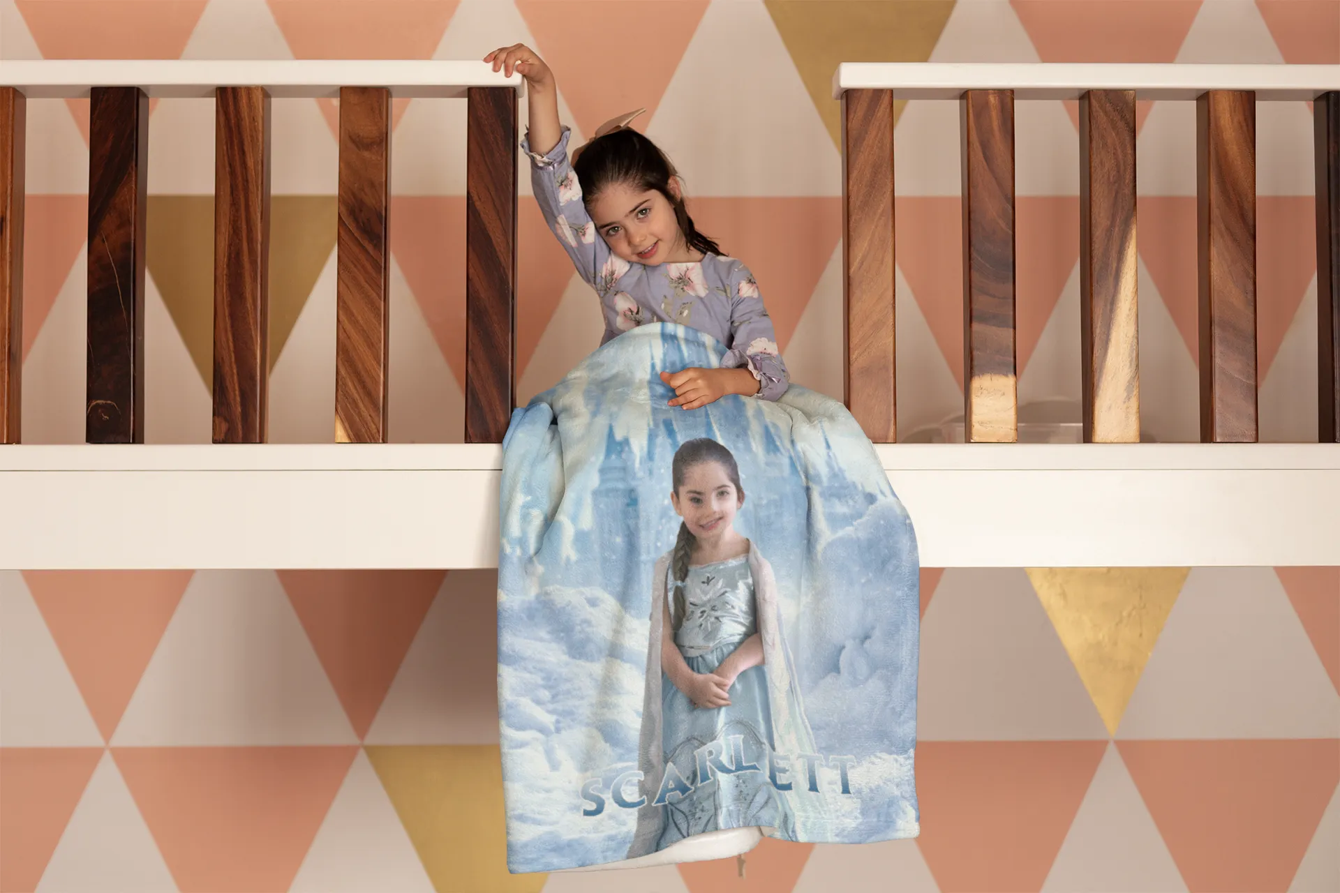 Girl sitting with her custom blanket with face and name