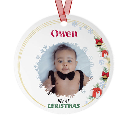 Round Christmas ornament with a photo of a baby and 'Owen' printed on it.