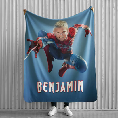 person holding personalized spiderman blanket